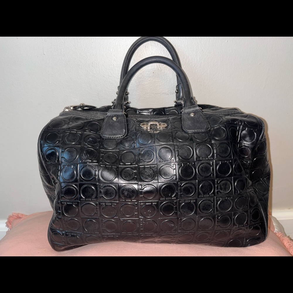Feminine elegance black handbag combined with practical. Good Condition